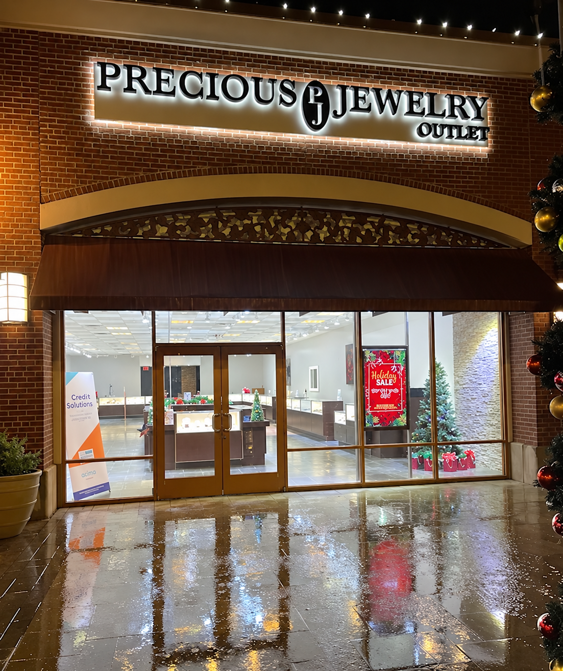 Precious Jewelry Outlet storefront in Allen, Texas, with its illuminated sign and showroom entrance